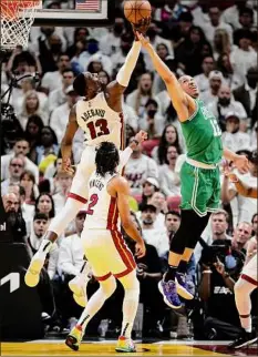  ?? Andy Lyons / Getty Images ?? Heat’s Bam Adebayo and Celtics’ Grant Williams go for the rebound during Game Seven. The game did not end in time for this edition, please visit www.timesunion.com.