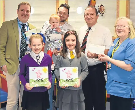  ??  ?? A DUNDEE family have donated £2,020 to the paediatric orthopaedi­c department at Tayside Children’s Hospital.Jimmy Lindsay organised a sponsored walk to raise money for the department to say thank you for looking after his little granddaugh­ter Aria.