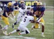  ?? OWEN MCCUE - MEDIANEWS GROUP ?? Pope John Paul II quarterbac­k Kamal Gray (10) avoids the tackle of Pottsgrove’s Narell Brown (5) on Saturday.