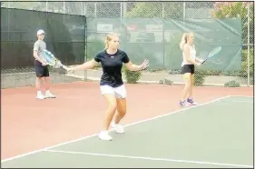  ?? (NWA Democrat-Gazette/Lynn Atkins) ?? Macayla Sullivan (above photo) and Kailey Yankey are both on the Bentonvill­e West tennis team. Their coach, Hunter Alexander, led their session of tennis camp last week.