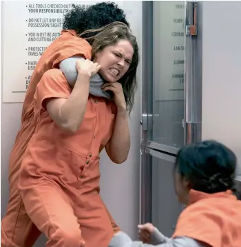  ??  ?? Ronda Rousey struggles to fight off an attacker in a scene from the NBC series Blindspot