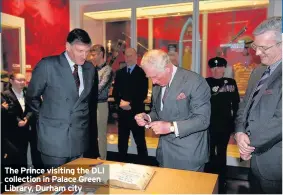  ??  ?? The Prince visiting the DLI collection in Palace Green Library, Durham city