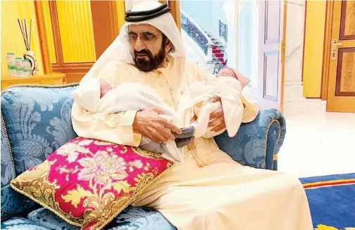  ??  ?? ↑
Sheikh Mohammed Bin Rashid with Dubai Crown Prince Sheikh Hamdan’s twins in Dubai on Monday.