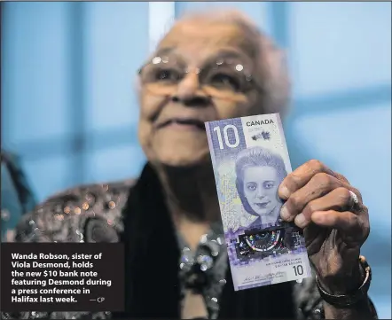  ?? —CP ?? Wanda Robson, sister of Viola Desmond, holds the new $10 bank note featuring Desmond during a press conference in Halifax last week.