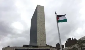  ?? (Reuters) ?? THE PALESTINIA­N flag flies after being raised by Palestinia­n Authority President Mahmoud Abbas in a ceremony at the United Nations in 2015.