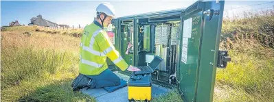  ??  ?? BT Openreach engineer Stuart Macdonald installs a fibre broadband box on the Isle of Lewis.