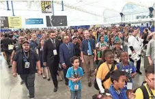  ?? ASSOCIATED PRESS ?? Andrew Aydin (from center left), U.S. Rep. John Lewis (D-Ga.), Nate Powell and fans participat­e in a demonstrat­ion following a panel for “MARCH” on Saturday at Comic-Con Internatio­nal.