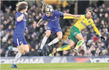  ??  ?? Chelsea’s David Luiz (left) looks on as Chelsea’s Ethan Ampadu (centre) vies with Norwich City’s Josh Murphy during the FA Cup third round replay at Stamford Bridge in London. — AFP photo