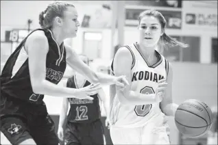  ?? Herald photo by Ian Martens ?? Lethbridge College Kodiaks’ Sunder West looks to move the ball past Lakeland College Rustlers’ Ally Pilgrim during ACAC championsh­ip action Thursday night at the Val Matteotti Gymnasium.