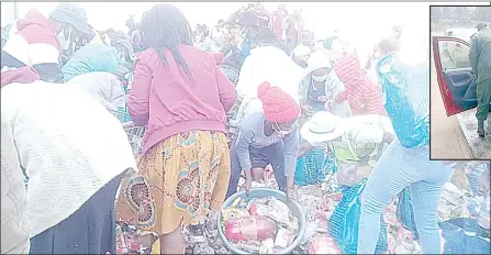  ?? ( Courtesy pics) ?? The people who ambushed security personnel and broke into the Nhlangano dumpsite where they spent three consecutiv­e days helping themselves on condemned food stuffs.