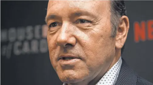  ?? NICHOLAS KAMM/ AFP/ GETTY IMAGES ?? More than a dozen accusers, including at least five who were teens at the time, have accused actor Kevin Spacey of sexually harassing, groping or attempting to rape them.
