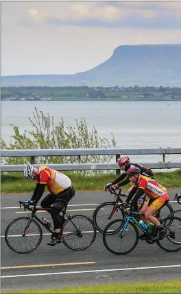  ??  ?? Cyclists during the Yeats Tour with Benbulben in the background.
