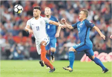  ??  ?? England’s Alex Oxlade-Chamberlai­n (left) vies with Slovakia’s Stanislav Lobotka during the World Cup 2018 qualifying match at Wembley Stadium in London in this Sept 4 file photo. — Reuters photo