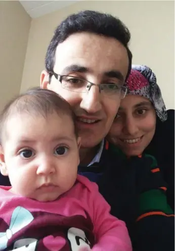  ??  ?? Queen’s University student Inan Korkmaz, with his wife and daughter, was granted asylum in Canada in March.