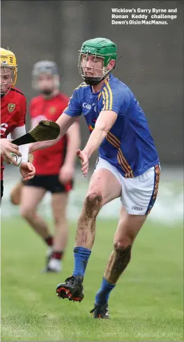  ??  ?? Wicklow’s Garry Byrne and Ronan Keddy challenge Down’s Oisin MacManus.