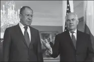  ?? ALEXANDER SHCHERBAK/TASS FILE PHOTOGRAPH ?? Russia’s Foreign Minister Sergei Lavrov, left, and U.S. Secretary of State Rex Tillerson speak to the media on May 10 before their talks at the State Department in Washington, D.C.
