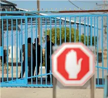  ?? PHOTO: GETTY IMAGES ?? Palestinia­ns wait at the Erez border crossing into Israel, in the northern Gaza Strip after it was shut by Hamas.