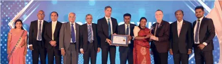  ?? ?? National Savings Bank DGM Finance Mr. Hasitha Athapattu & the team accepting the awards at the event