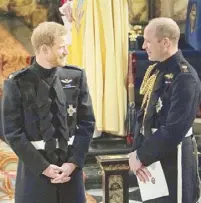  ?? Photo by OWEN HUMPHREYS/AFP ?? Prince Harry and Prince William at St George’s Chapel, Windsor Castle, in Windsor, awaiting the former’s wedding to Meghan Markle in 2018.