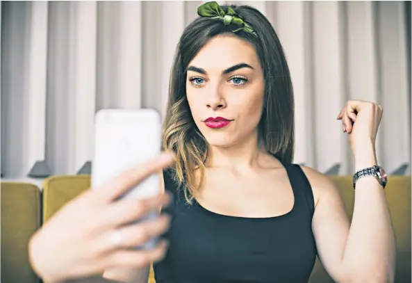  ??  ?? Selfie sufficient: students are turning to ‘camming’ to support themselves (posed by a model)