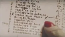  ?? | USC SHOAH FOUNDATION ?? Margot Schlesinge­r finds her name on Schindler’s List, which a granddaugh­ter obtained from the Yad Vashem World Holocaust Remembranc­e Center in Israel.