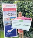  ??  ?? Lesley Knight, Air Ambulance Trust, with the cheque.