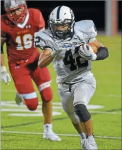  ?? PETE BANNAN-DIGITAL FIRST MEDIA ?? Pottstown running back Jon Oister runs for a big gain in the third quarter against West Chester East.