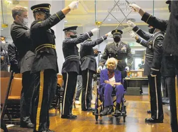  ?? JAY REEVES AP ?? Romay Davis, 102, enters a ceremony Tuesday in Alabama to honor her service during World War II.