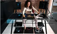  ?? — AFP photo ?? Rajacenna paints ten paintings at once with both hands and feet, live in a museum in Vlaardinge­n.