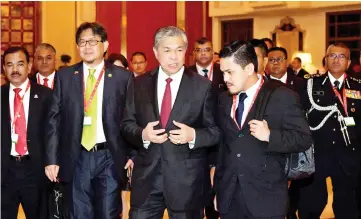  ?? — Bernama photo ?? Zahid (centre), with IGP Tan Sri Mohamad Fuzi Harun (right), and Malaysian Ambassador to China Datuk Zainuddin Yahya (second left), on their working visit to Beijing to attend the 86th Interpol General Assembly.