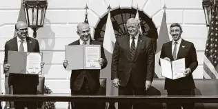  ?? Alex Brandon / Associated Press ?? President Donald Trump stands with, from left, Bahrain Foreign Minister Khalid bin Ahmed Al Khalifa, Israeli Prime Minister Benjamin Netanyahu and United Arab Emirates Foreign Minister Abdullah bin Zayed al-nahyan at a signing ceremony that wasn’t supposed to happen.