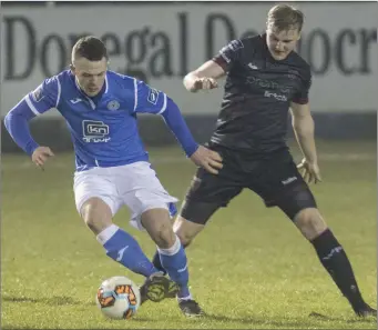  ??  ?? Ciarán O’Connor of Finn Harps tries to give Wexford F.C. defender A.J. Lehane the slip.