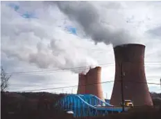  ?? Bloomberg ?? ■ The FirstEnerg­y Corp Beaver Valley nuclear power station next to the Shippingpo­rt Bridge in Pennsylvan­ia.