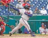  ?? AP PHOTO/ALEX BRANDON ?? Atlanta Braves pinch hitter Pablo Sandoval watches his two-run homer during the seventh inning of Wednesday’s second game against the host Washington Nationals. The Braves won 2-0 after taking the day’s first game 7-6 for their first victory this season.