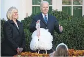  ?? ANNA MONEYMAKER GETTY IMAGES ?? President Joe Biden pardons Peanut Butter the turkey in the Rose Garden of the White House on Friday.