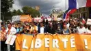  ??  ?? A mandatory health pass for entry to restaurant­s and cultural sites has sparked mass protests across France for eight consecutiv­e weeks
