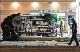  ?? PHOTOS BY LANNIS WATERS / THE PALM BEACH POST ?? Deputies investigat­e a crash at Military Trail and Belvedere Road early Monday. This truck was driven by Bradley Gardner, who sustained only minor injuries in the crash.