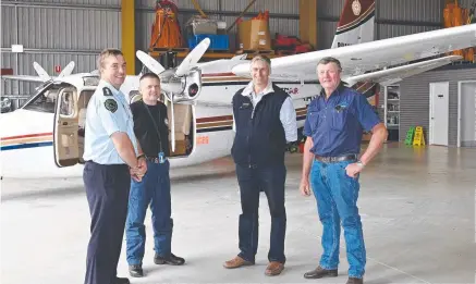  ?? Picture: Bev Lacey. ?? AIR SUPPORT: Ready to attack with water bombers are (from left) Area Director for Rural Fire Service Darling Downs Inspector John Welke, RFS Air Attack Supervisor Brett McIlwaine,and rural fireys Matthew Finch and Murray Wise.