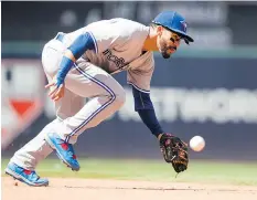  ?? JASON MILLER/GETTY IMAGES ?? Toronto Blue Jays second baseman Devon Travis missed a second consecutiv­e game on Wednesday after receiving a cortisone injection in an ailing right hand.