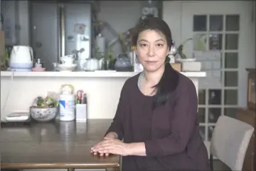  ?? — Bloomberg photos ?? Orie Ikeda sits for a photograph in her home in Toyonaka, Osaka Prefecture.