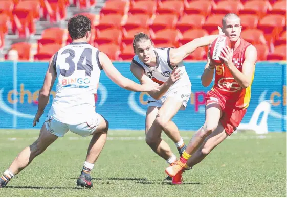  ?? Picture: RICHARD GOSLING ?? Midfielder Bailey Scott (right) in action for the Gold Coast Suns’ NEAFL side against GWS in August.