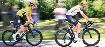  ?? — AFP photo ?? Great Britain’s Geraint Thomas (left), wearing the overall leader’s yellow jersey, rides behind Great Britain’s Christophe­r Froome during the 207,5 km fourth stage of the 104th edition of the Tour de France cycling race on July 4 file photo between...