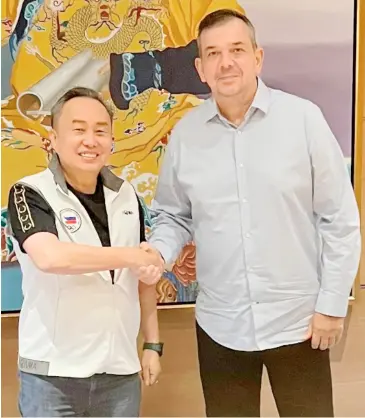  ?? PHOTOGRAPH COURTESY OF POC ?? NEWLY-appointed Philippine Sports Commission chairperso­n Richard ‘Dickie’ Bachmann (right) and Philippine Olympic Committee president Abraham ‘Bambol’ Tolentino vow to join hands for the sake of the national athletes in the runup to the Paris 2024 Olympics. The two top officials met over dinner Saturday at the Conrad Manila.