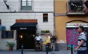  ?? NYT PIC ?? Tourists at a bar in downtown Barcelona, Spain. The slowdown in economy holds the potential to intensify the sense of grievance roiling many societies.