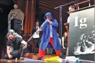  ?? GRETCHEN ERTL / REUTERS ?? Didgeridoo instructor Alex Suarez performs at the Ig Nobel Prize spoof awards at Harvard University.