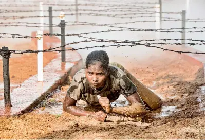  ??  ?? A CISF jawan undergoing a rigorous training at RTC, Arrakonam