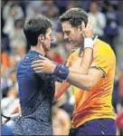  ?? AFP ?? Novak Djokovic hugs Juan Martin del Potro after the final which lasted 3 hours and 15 minutes.