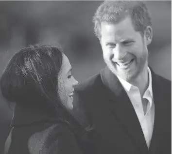  ?? DAN KITWOOD / GETTY IMAGES FILES ?? Prince Harry and his fiancée Meghan Markle visit the Nottingham Academy on Friday.