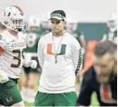  ?? MICHAEL LAUGHLIN/SOUTH FLORIDA SUN SENTINEL ?? UM coach Manny Diaz watches his defense during the first practice of the fall camp in 2019. This year, camp will look different, with new rules affecting contact and behavior because of the COVID-19 pandemic.