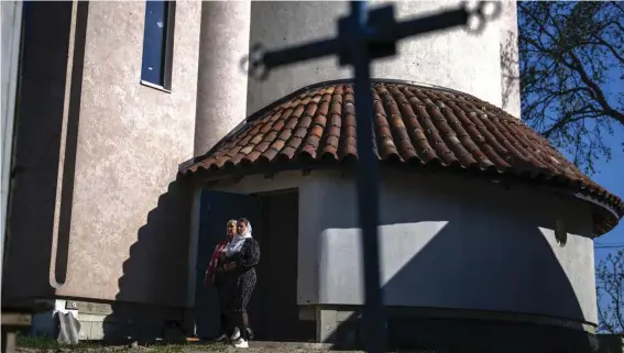  ?? Outside. (AP Photo/Francisco Seco) ?? Christian Orthodox worshipper­s leave the chapel basement after attending a service at the Church of the Intercessi­on of the Blessed Virgin Mary in, Lypivka, near Lviv, Ukraine, Sunday, April 28, 2024. This Orthodox Easter season, an extraordin­ary new church is bringing spiritual comfort to war-weary residents of the Ukrainian village of Lypivka. Two years ago it also provided physical refuge from horrors